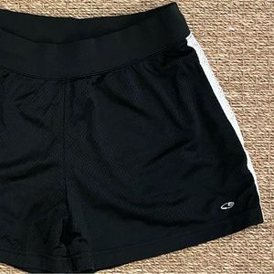 Champion C9 black mesh shorts with black lining and white stripes on each side